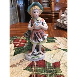 home interiors girl with bonnet holding bird figurine 8880 pottery‎